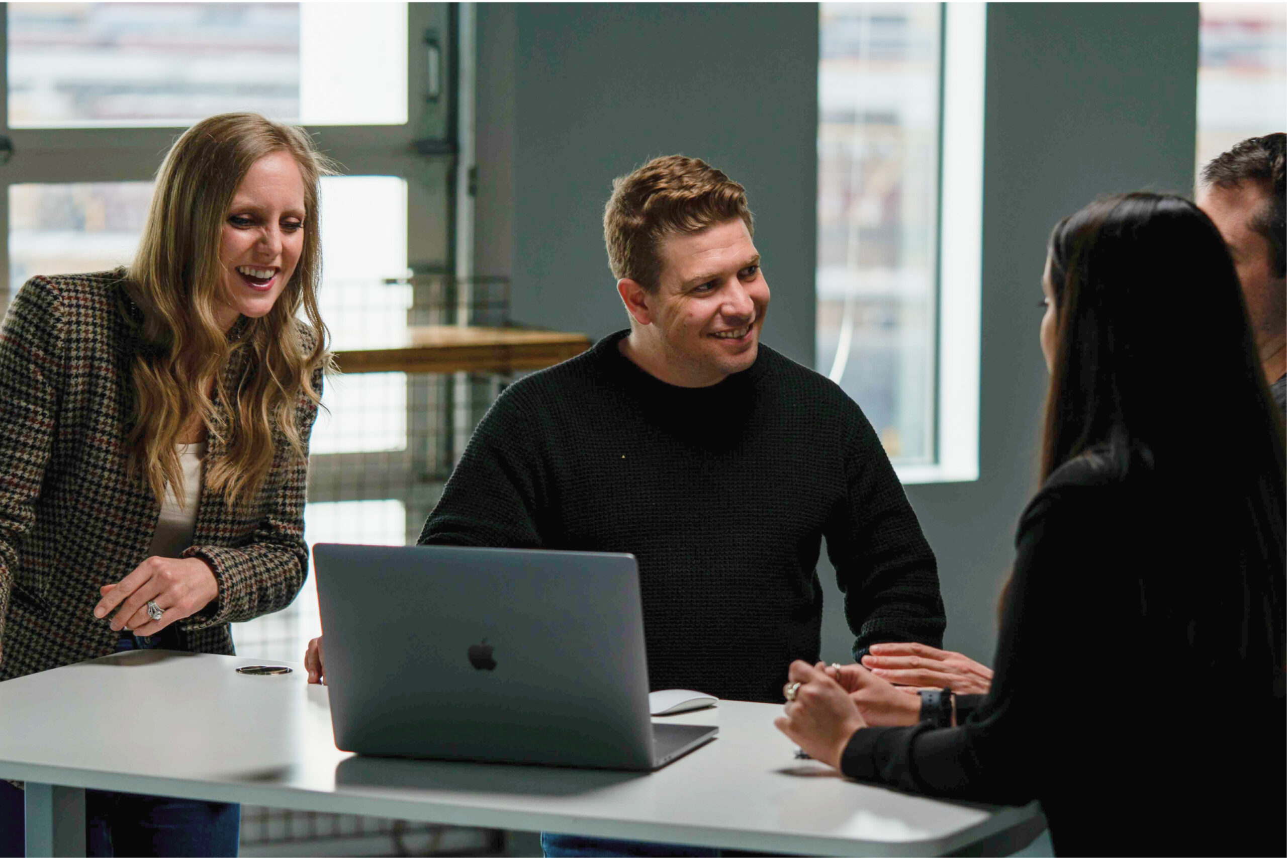 Team meeting around computer