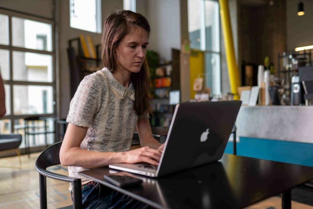 Web expert working at computer.