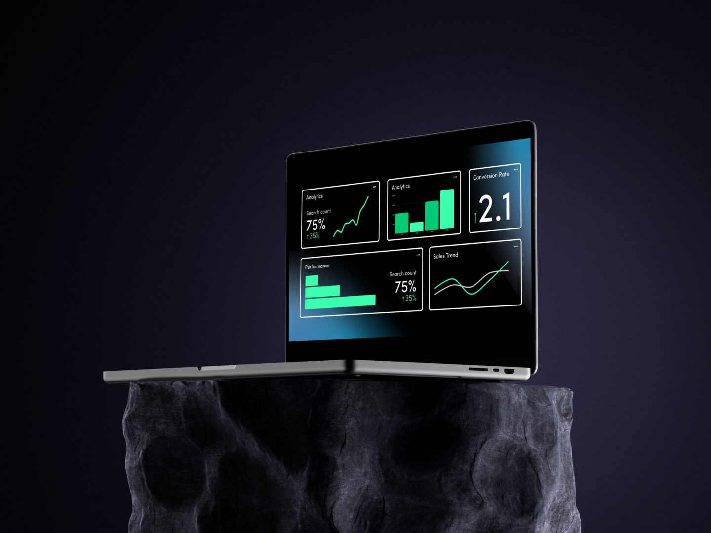 Silver laptop displaying website analytics dashboards, including graphs, charts, and a 2.1 conversion rate metric, placed on a dark stone pedestal against a black background, symbolizing digital performance and KPIs for websites.