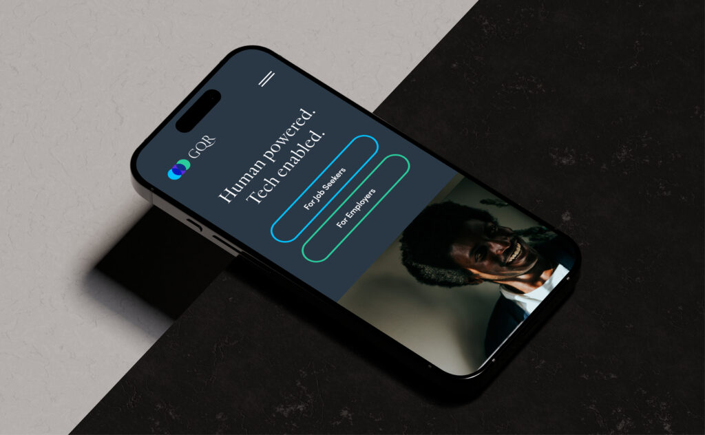 Smartphone displaying mobile app interface on surface