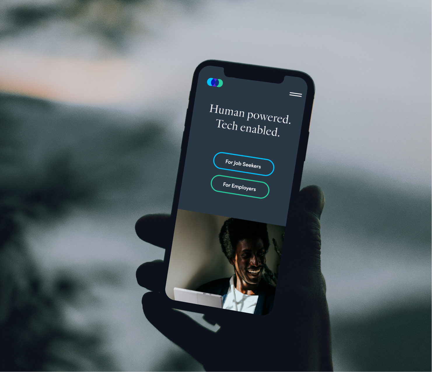 Smartphone displaying mobile app interface outdoors