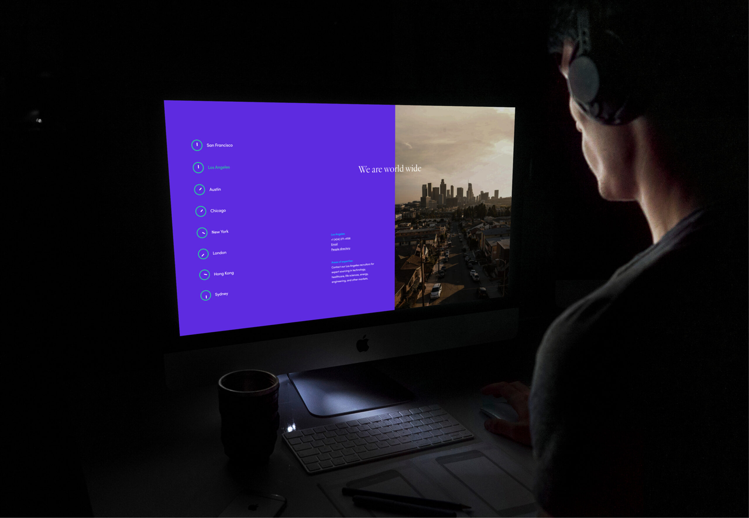 Person using laptop with purple UI interface