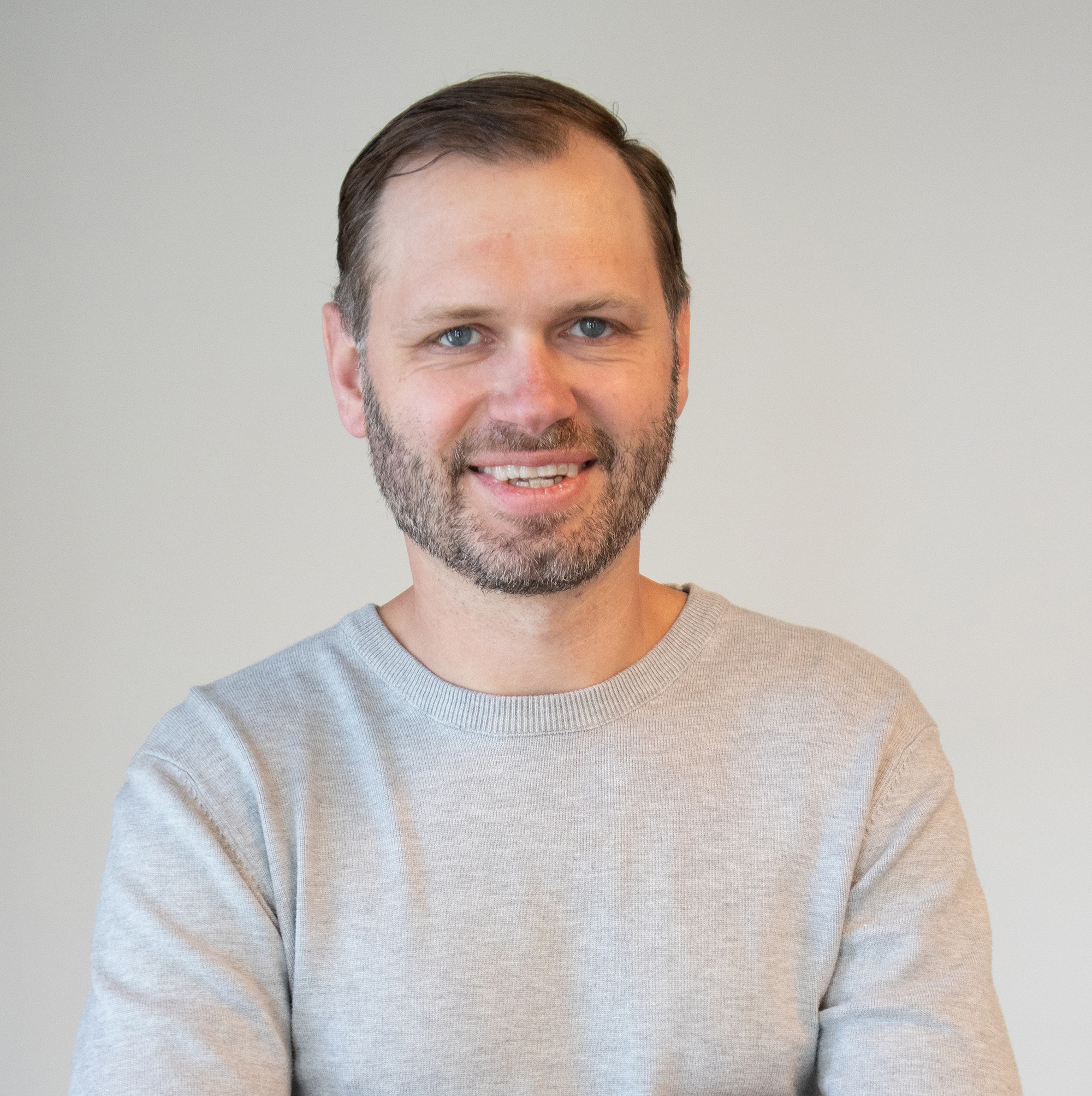 Professional headshot of Chris Kuhn