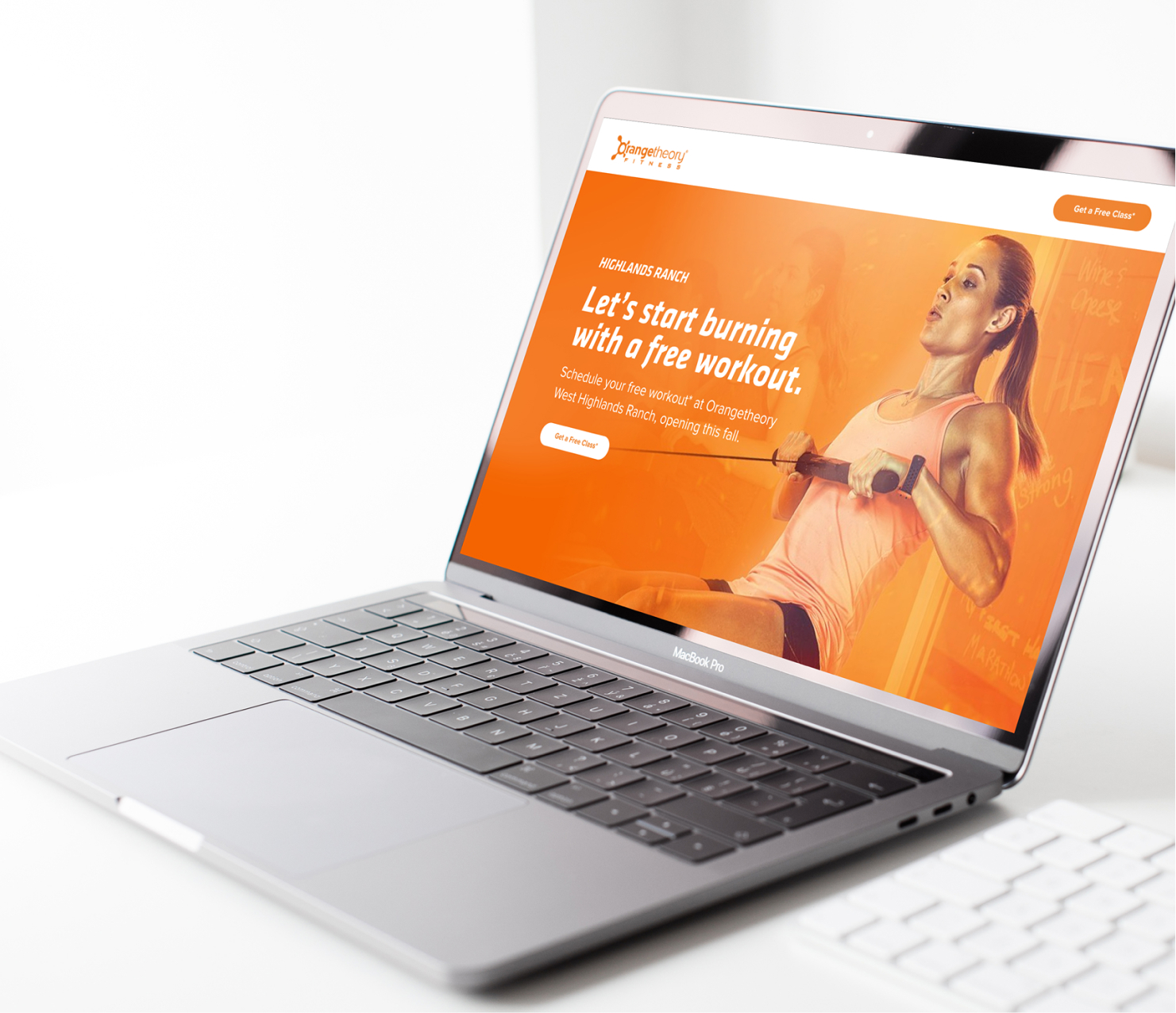 Laptop displaying fitness website on desk