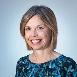 Professional headshot of female team member smiling