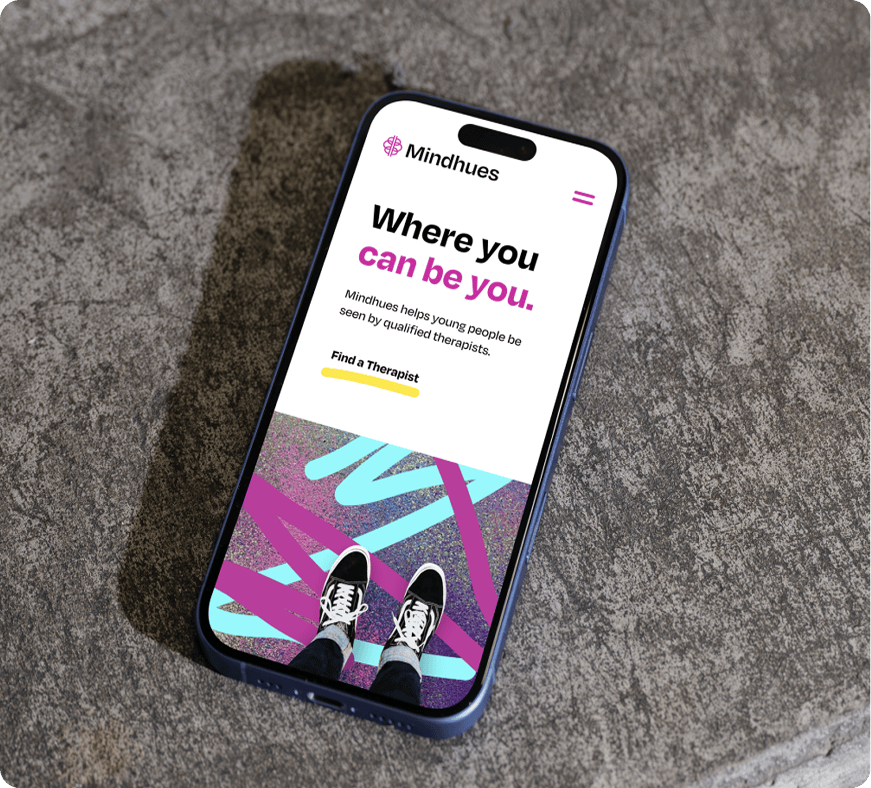 Smartphone displaying mobile app interface on stone surface