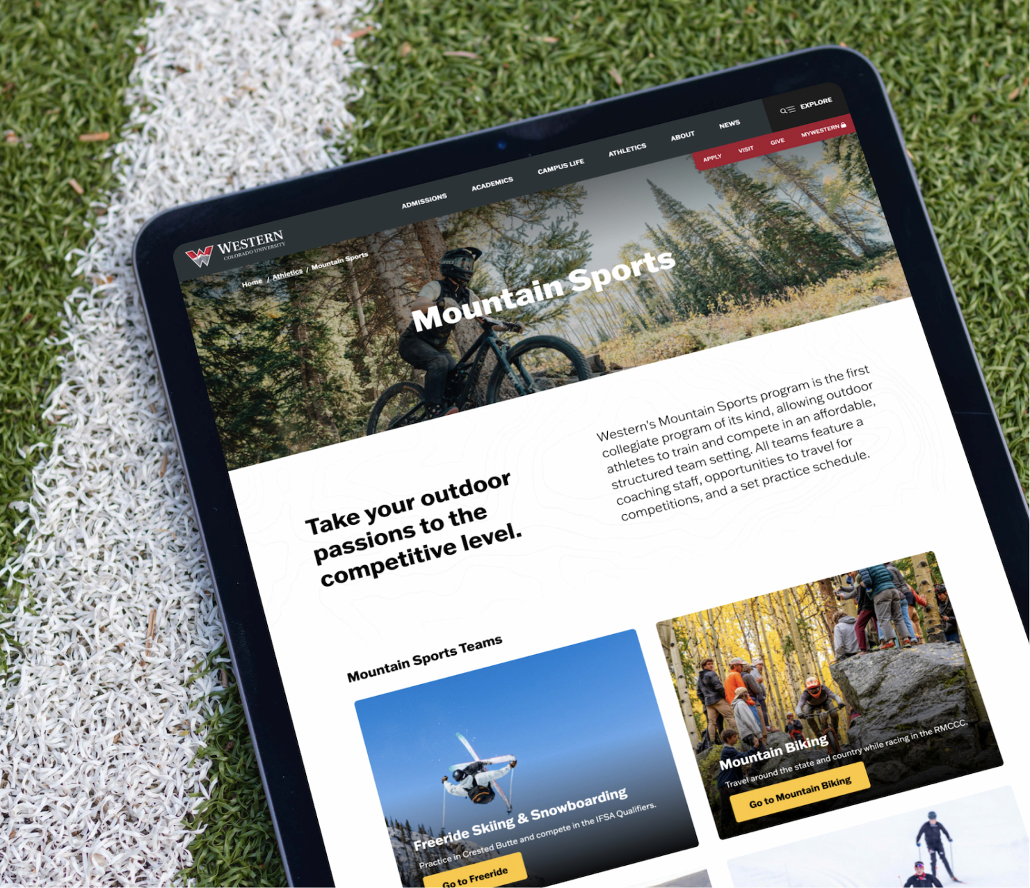 Tablet displaying education website homepage outdoors