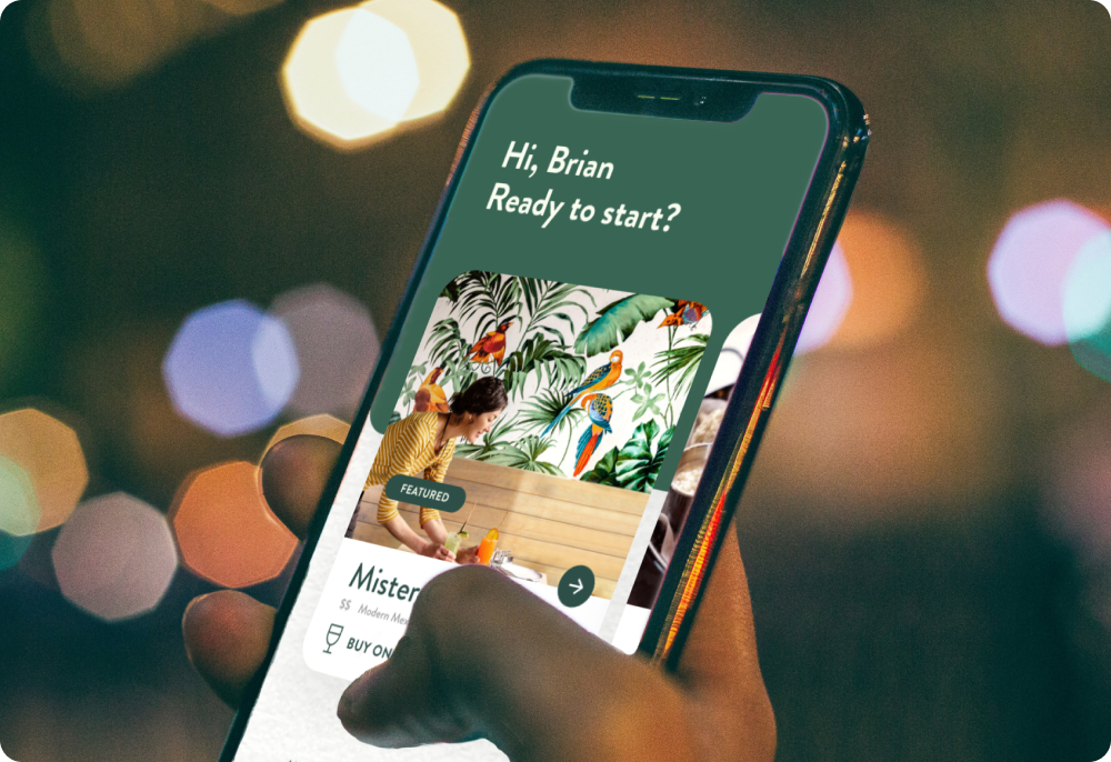 Smartphone displaying mobile app interface with bokeh background