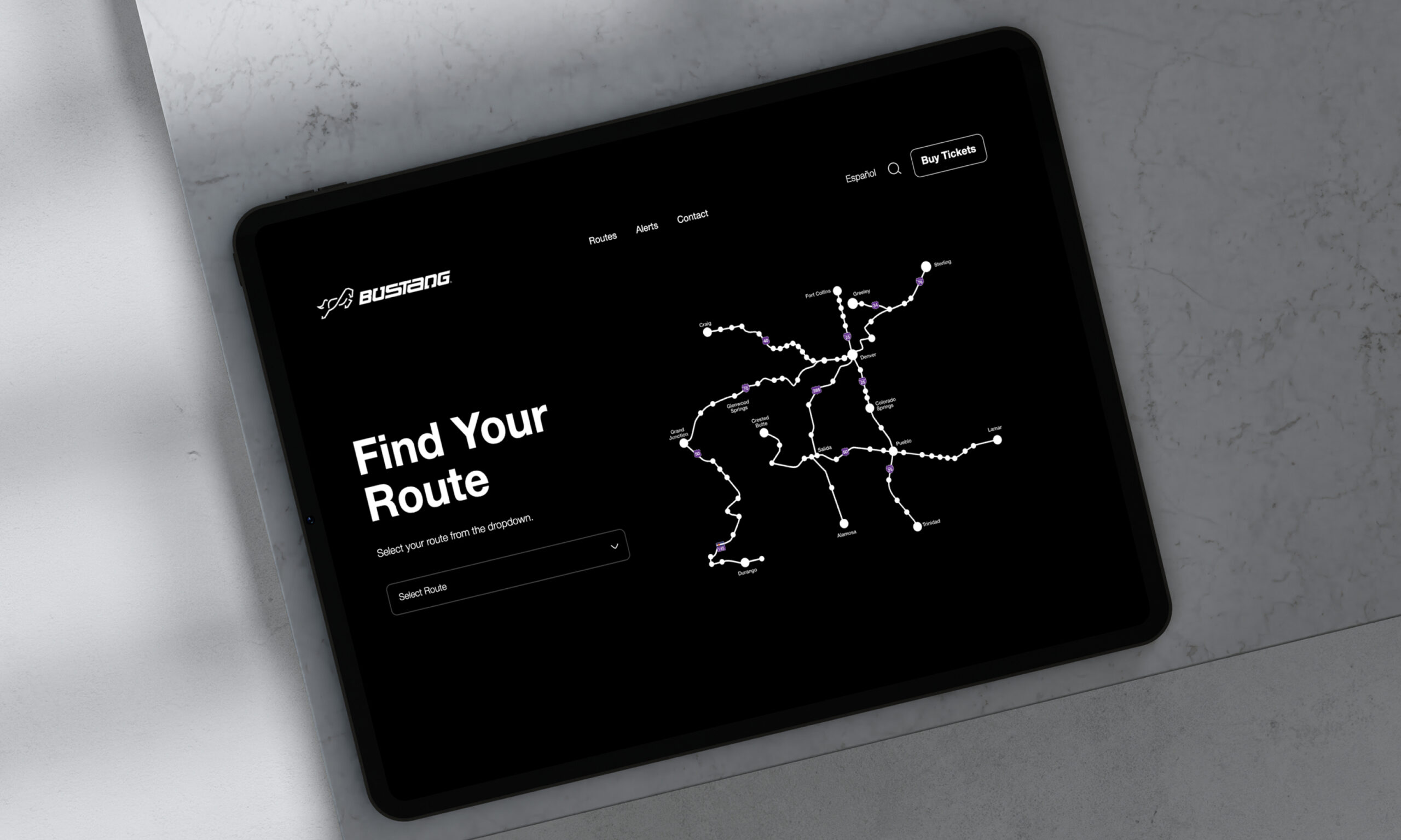 Tablet displaying dark UI interface on desk