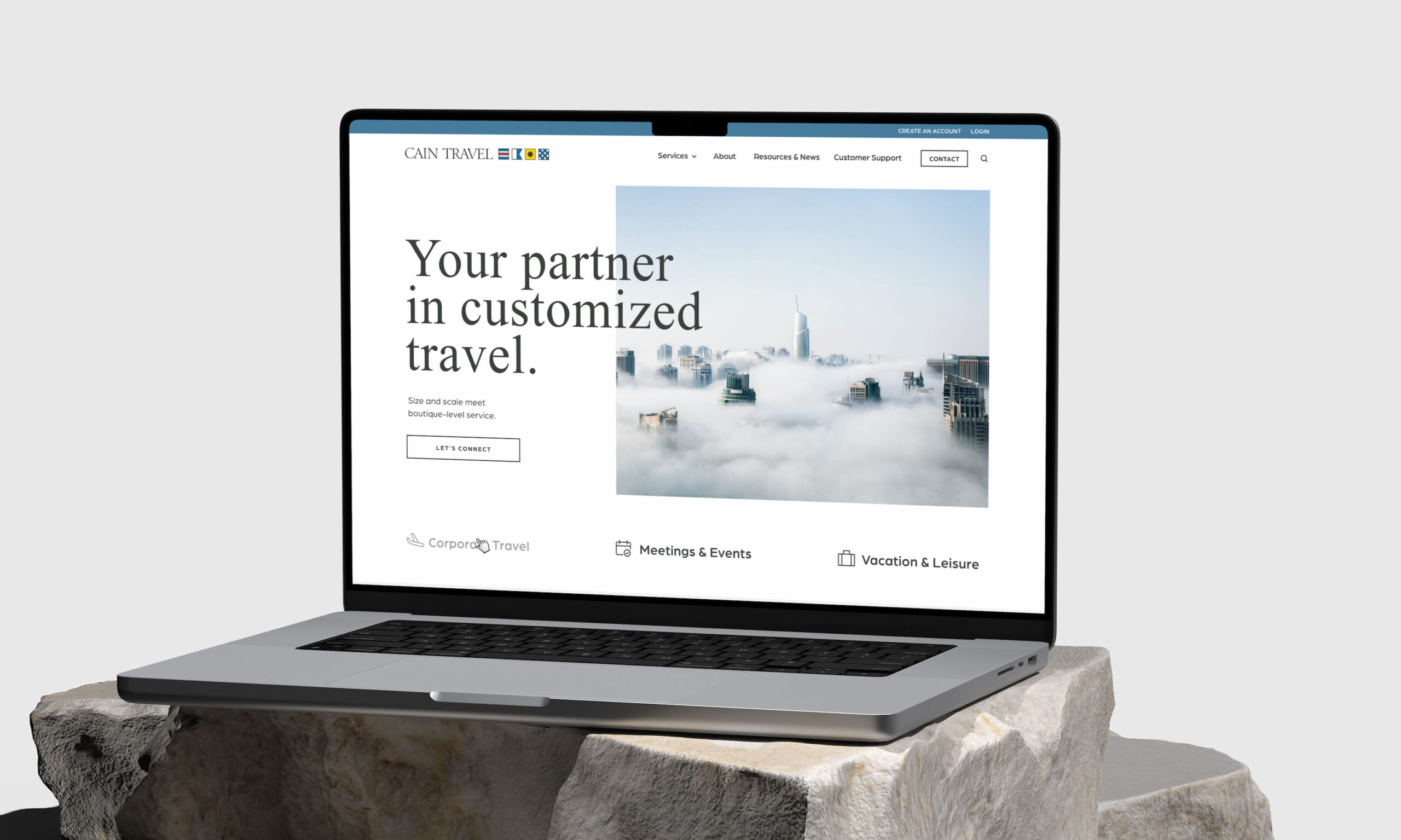 Laptop displaying website homepage on desk