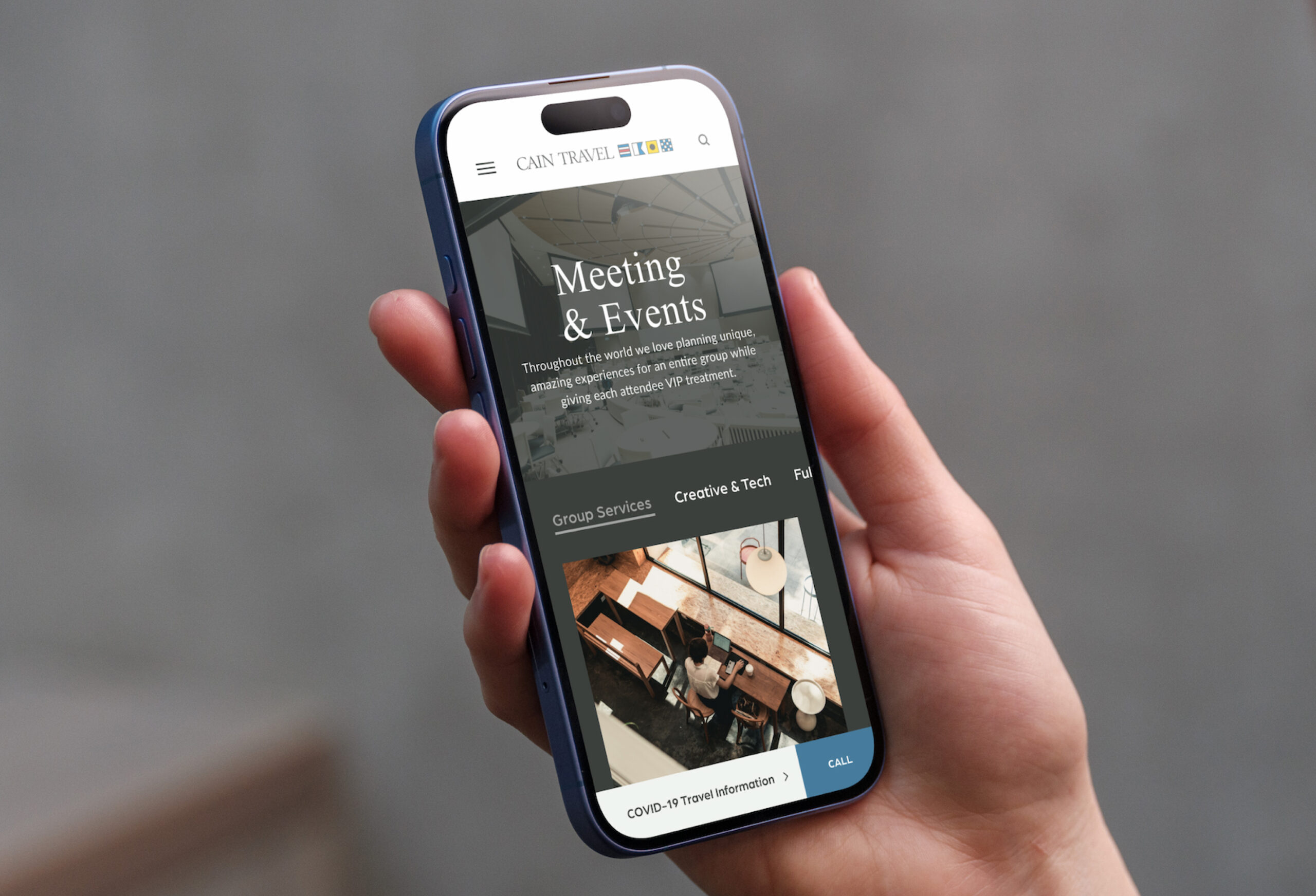 Smartphone displaying website interface in hand