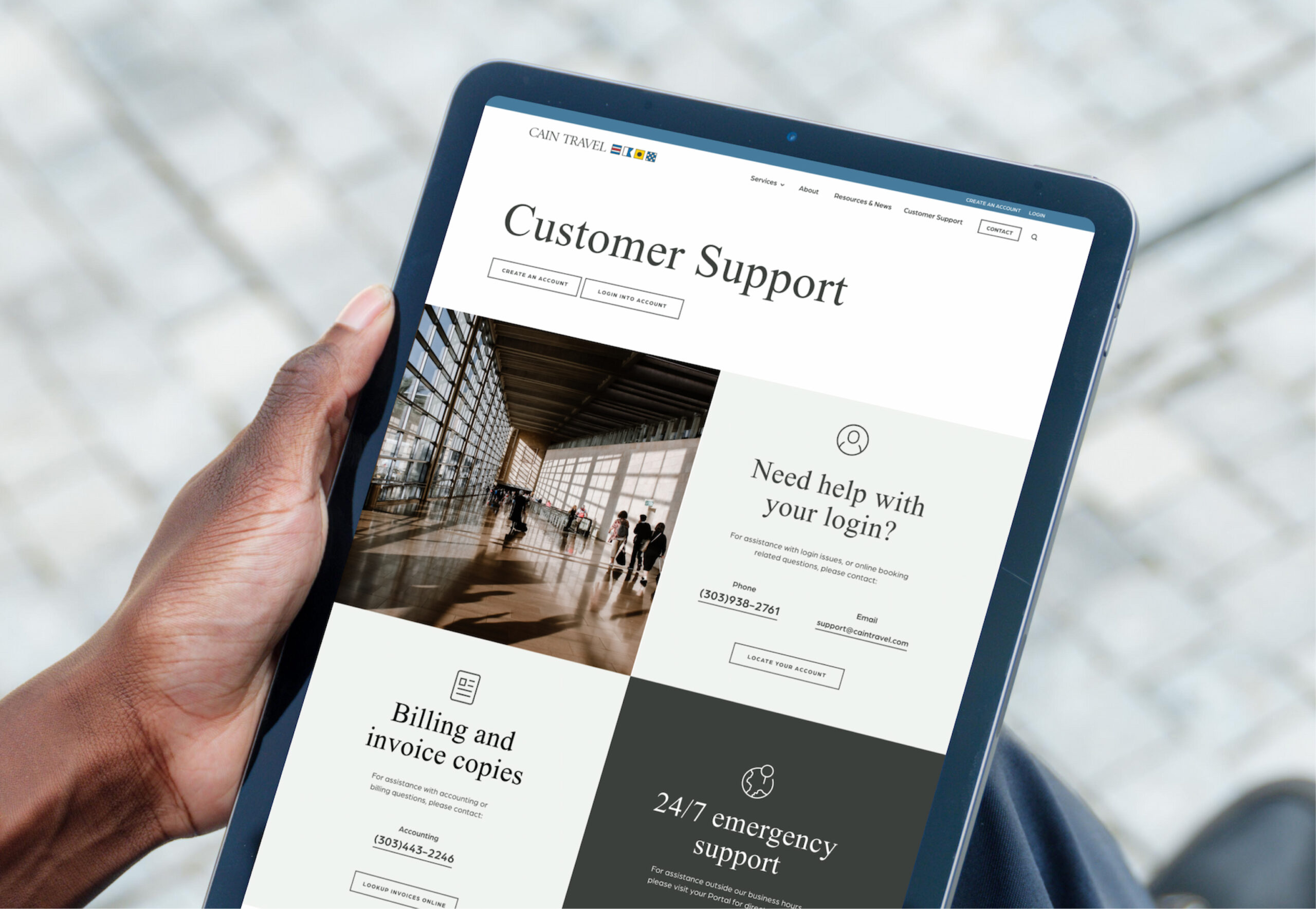 Tablet showing travel website design on wooden surface