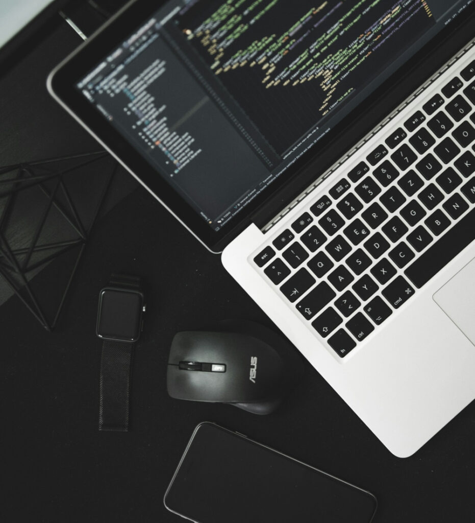 Laptop displaying dark theme dashboard interface