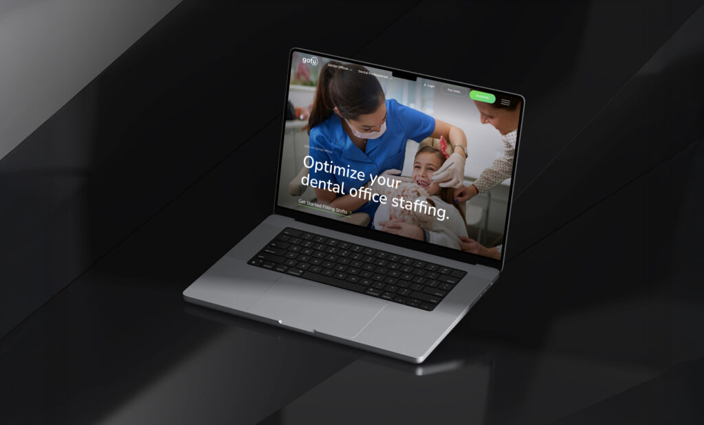 Laptop displaying website homepage in dark setting