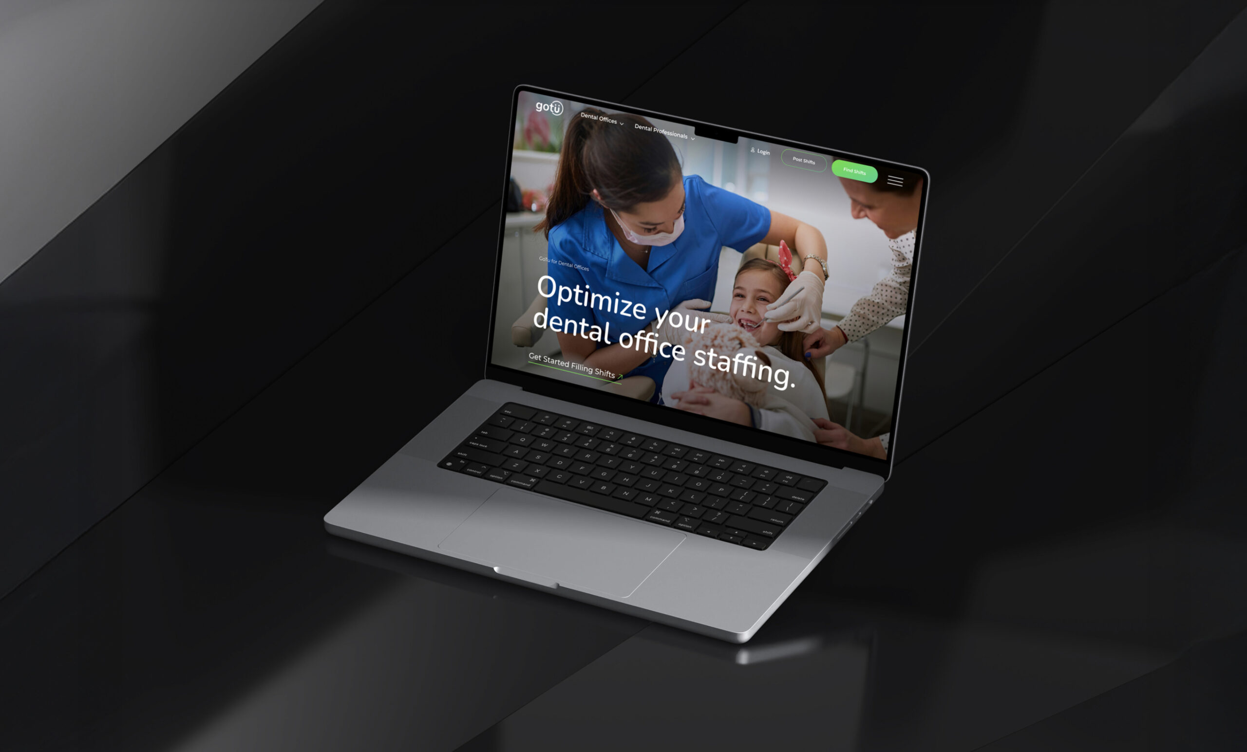 Laptop displaying website homepage in dark setting