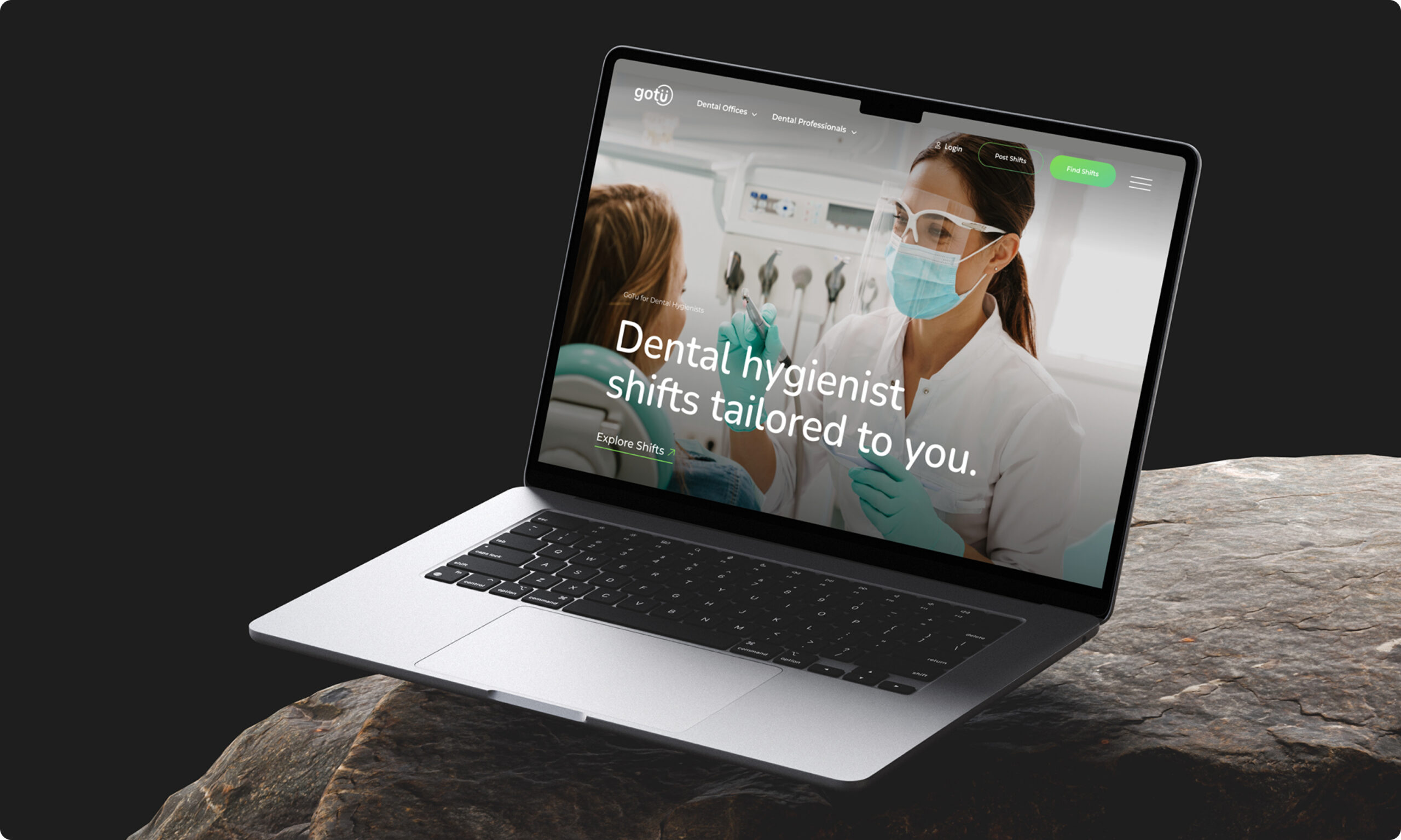 Laptop displaying website homepage on desk