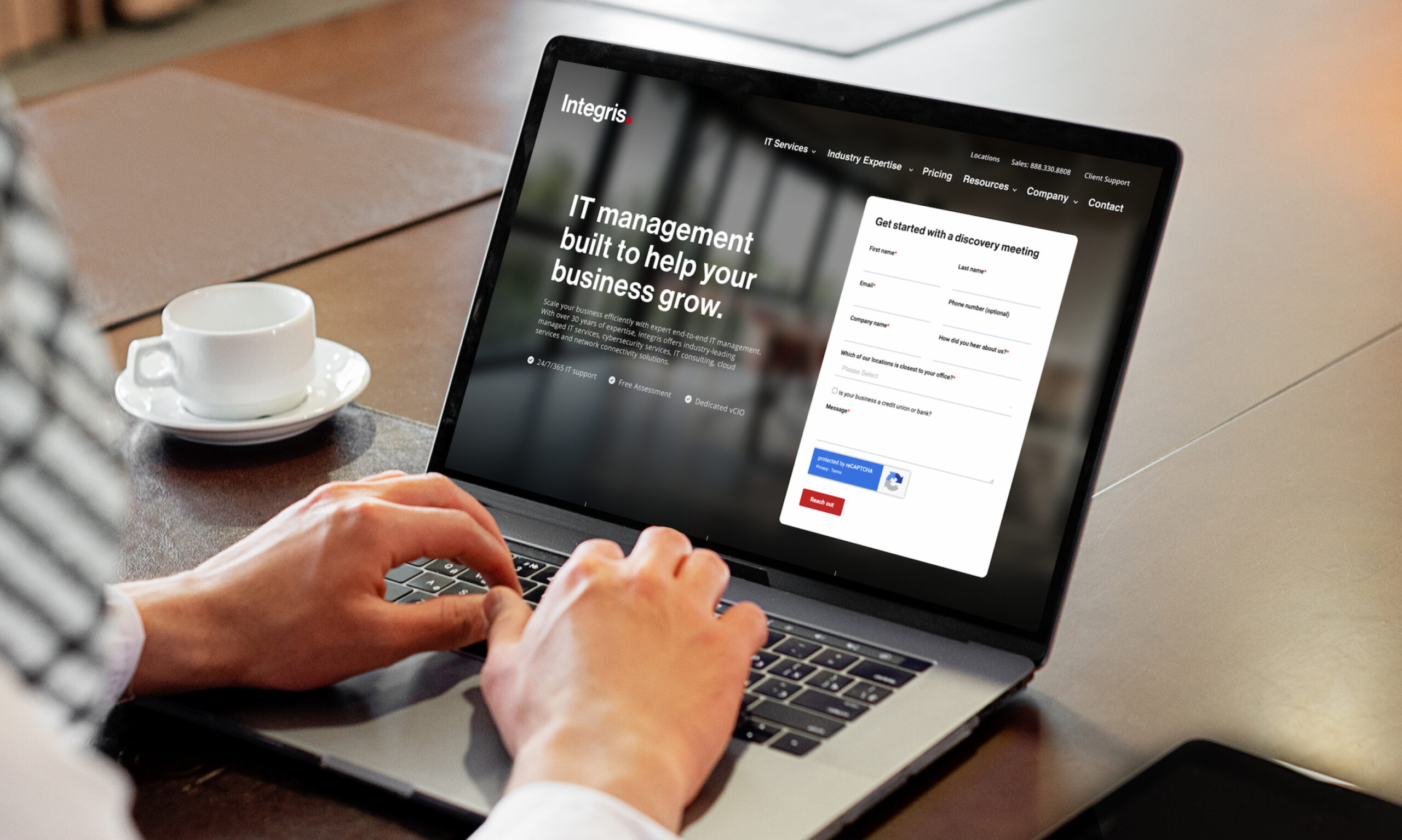 Person using laptop to interact with website interface