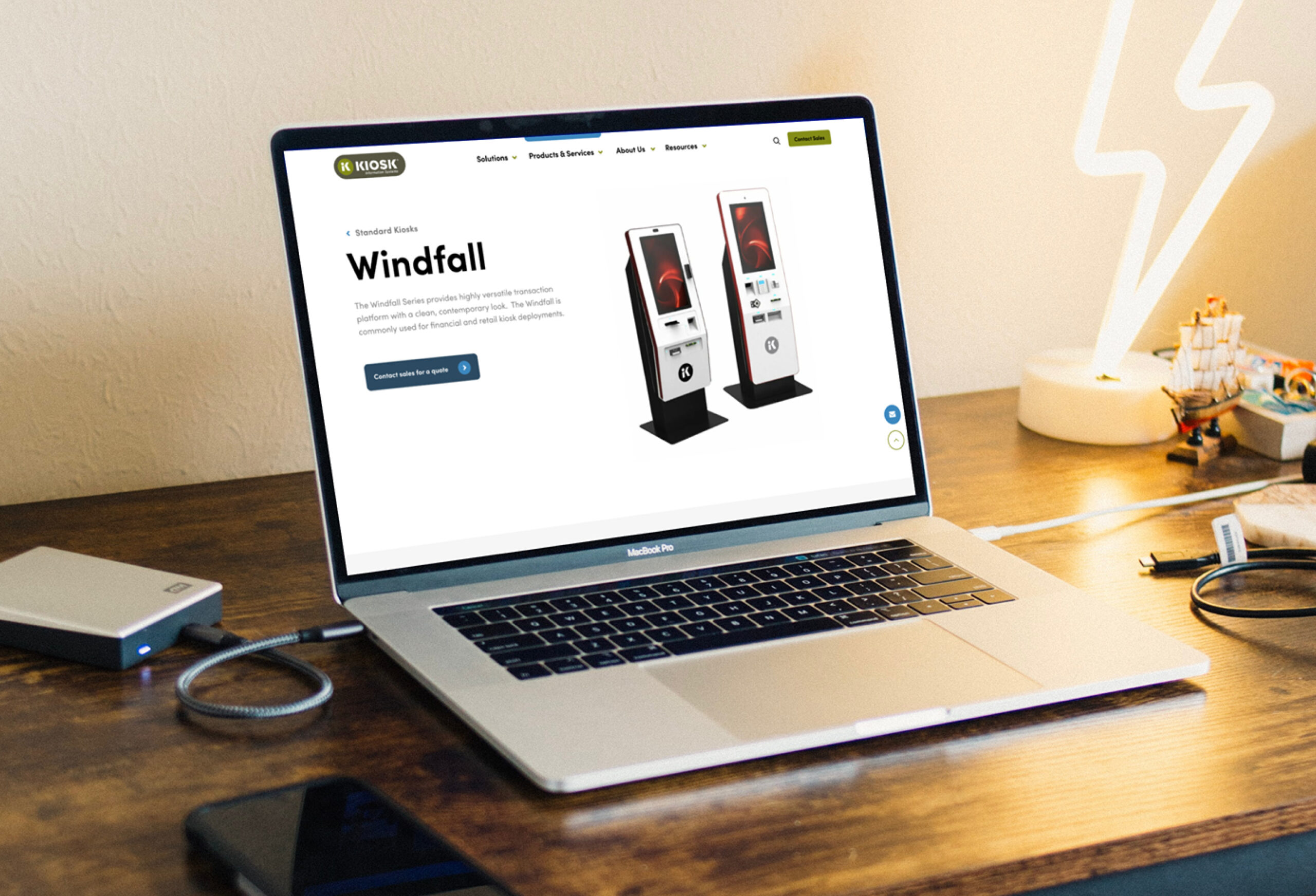 Laptop displaying ecommerce product page on desk