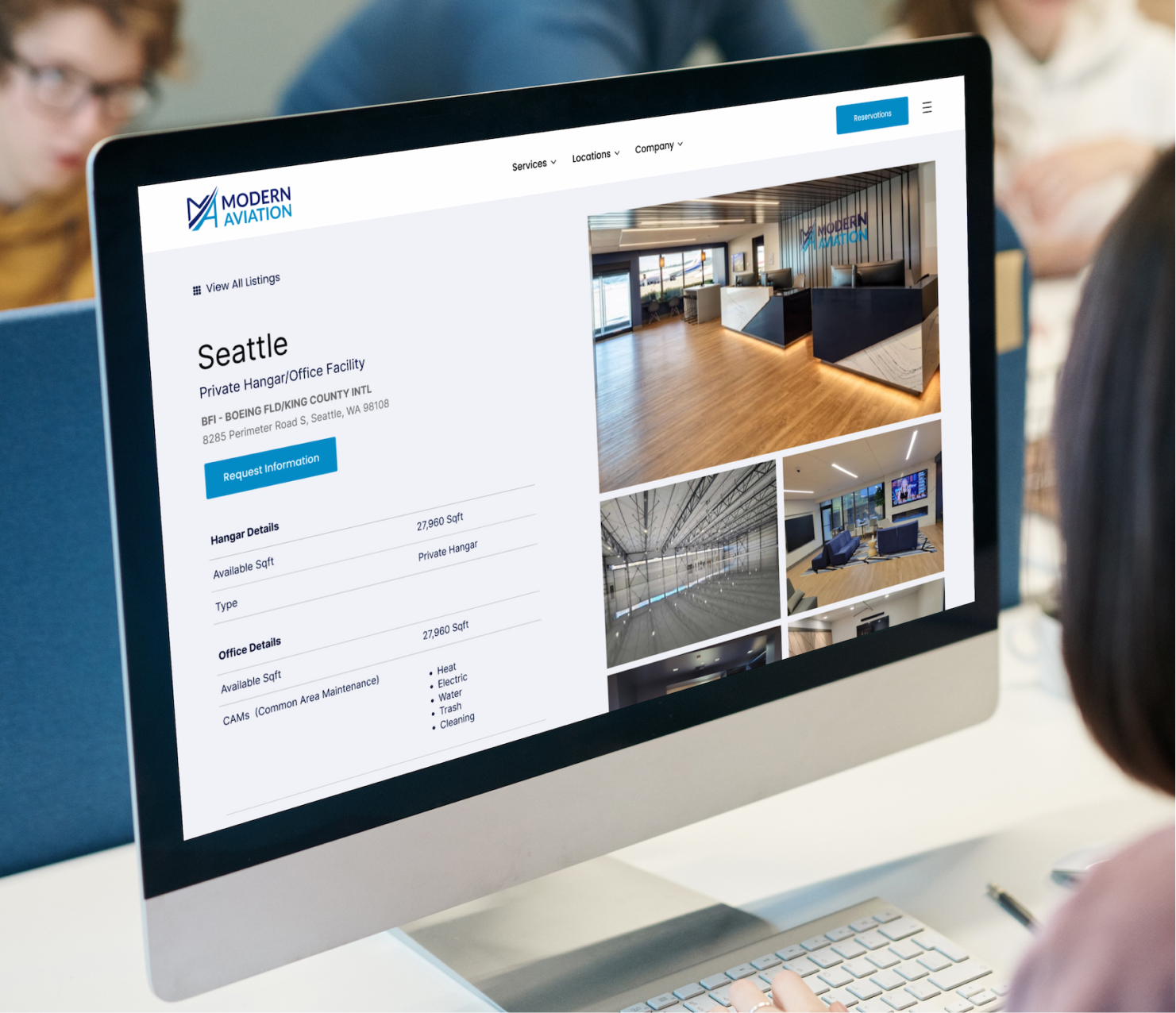 Desktop monitor displaying website interface in office