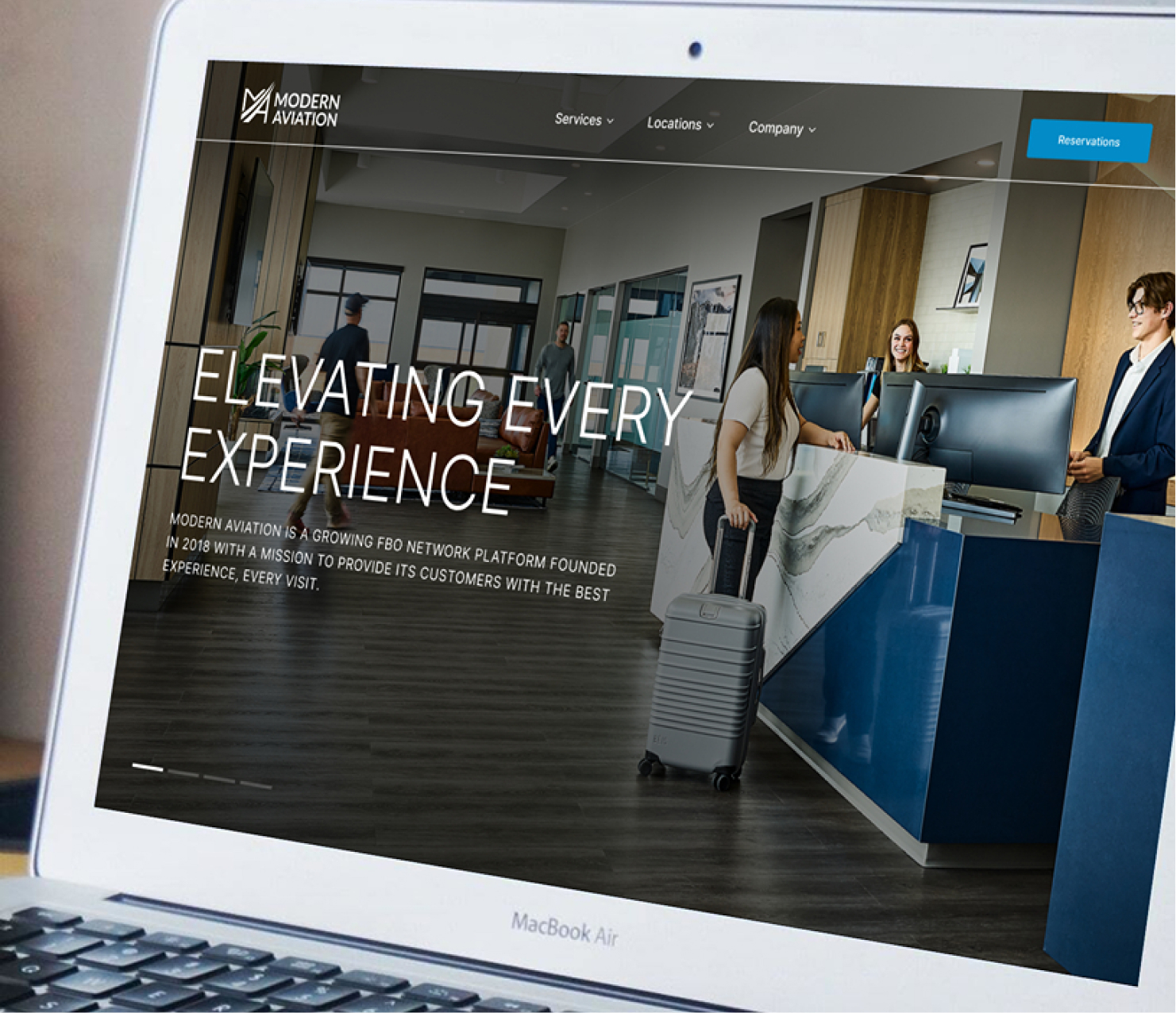 Laptop displaying corporate website homepage