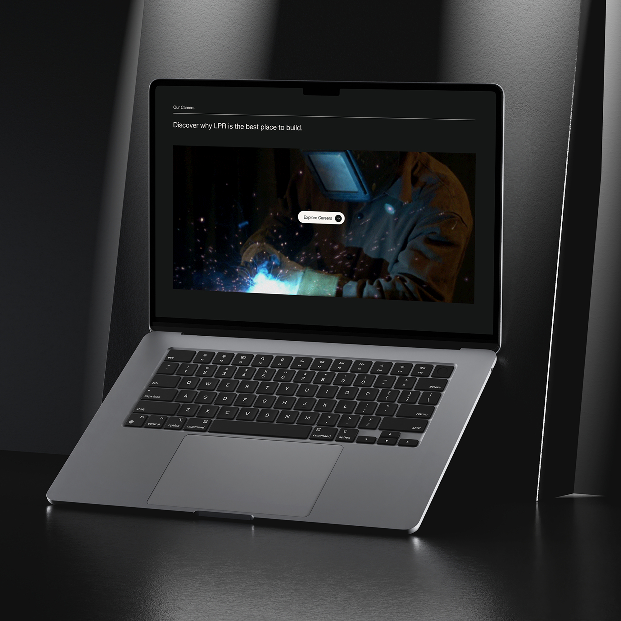 Laptop displaying dark theme website homepage