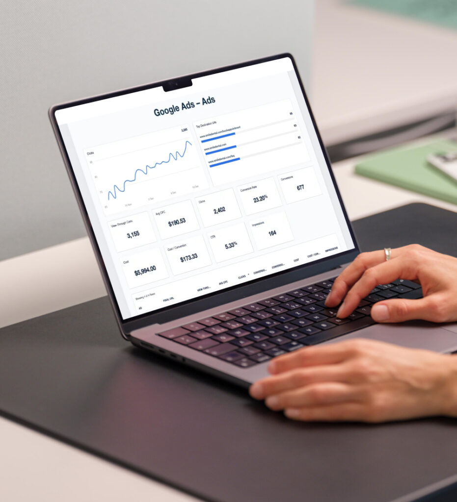 Person using laptop to interact with dashboard