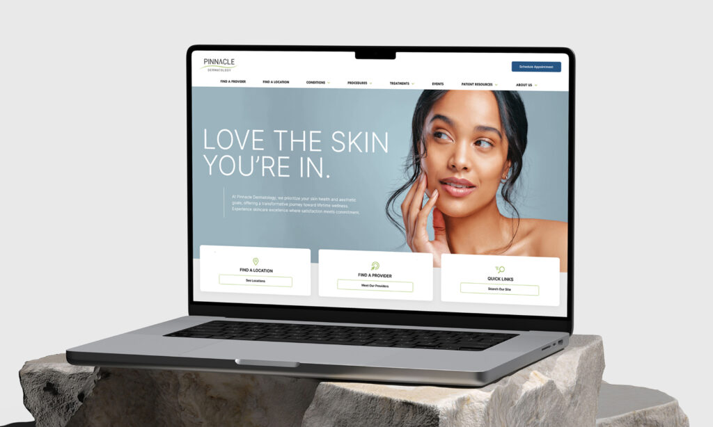 Laptop displaying website with user profile section