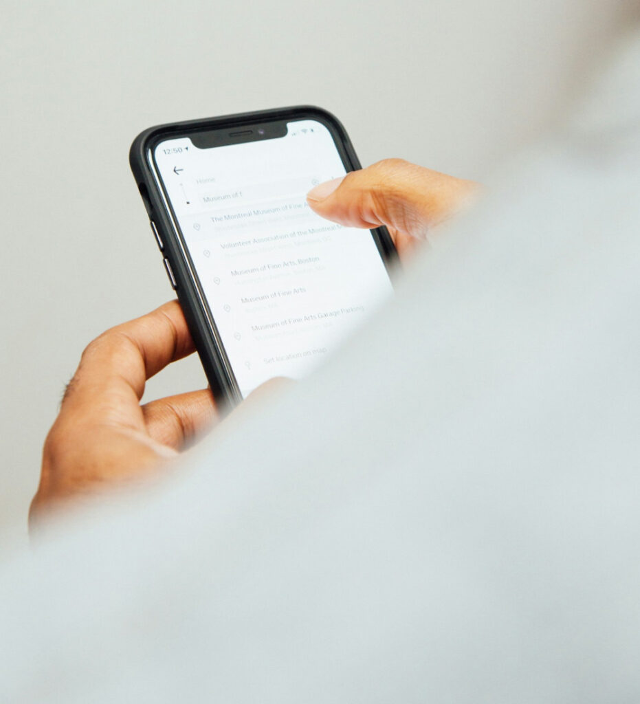 Person holding smartphone with blank screen