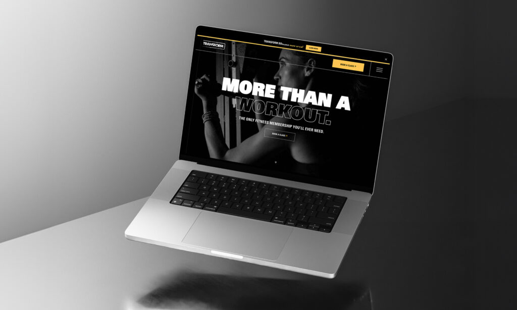 Laptop displaying dark theme website homepage