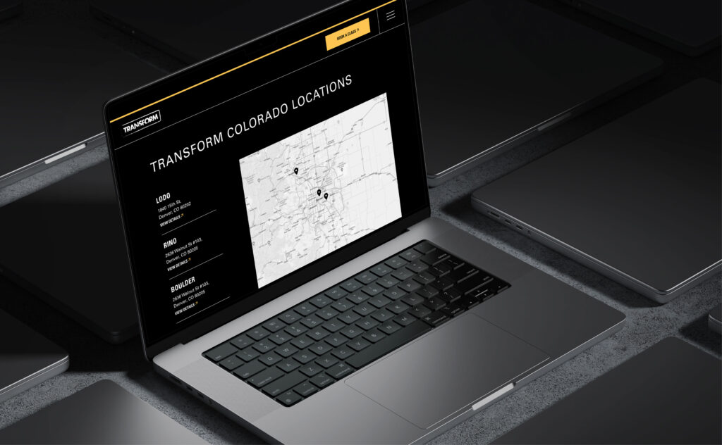 Laptop displaying dark theme website dashboard