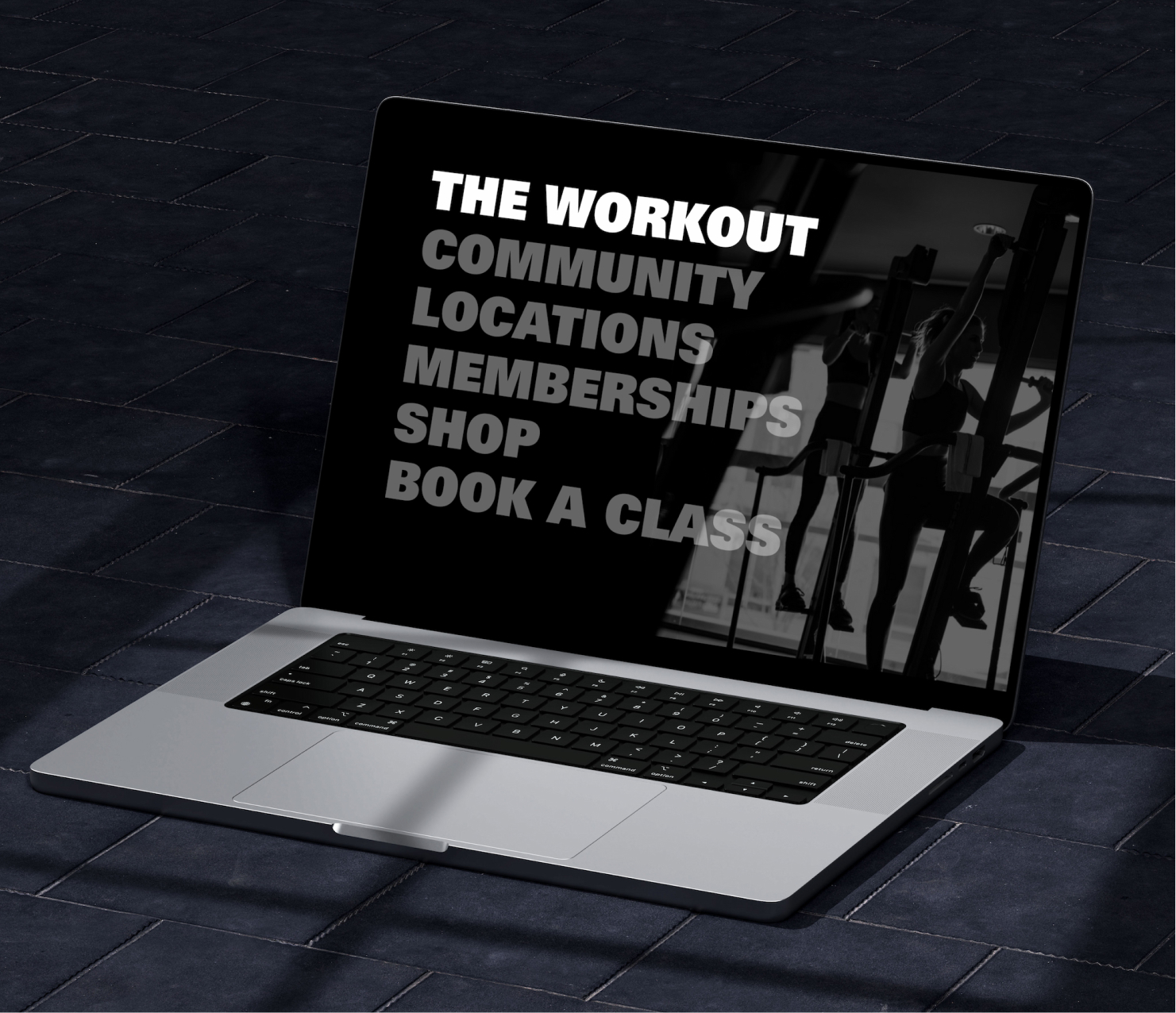 Laptop displaying fitness website homepage