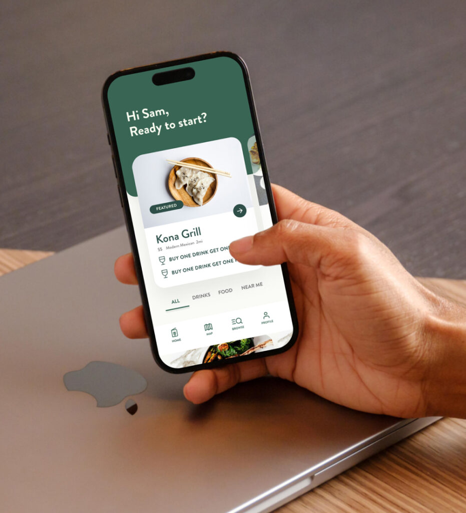 Smartphone displaying mobile app interface in hand