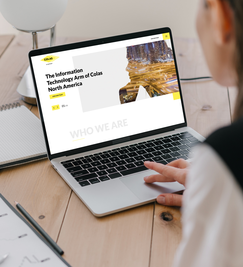 Laptop displaying website homepage on desk