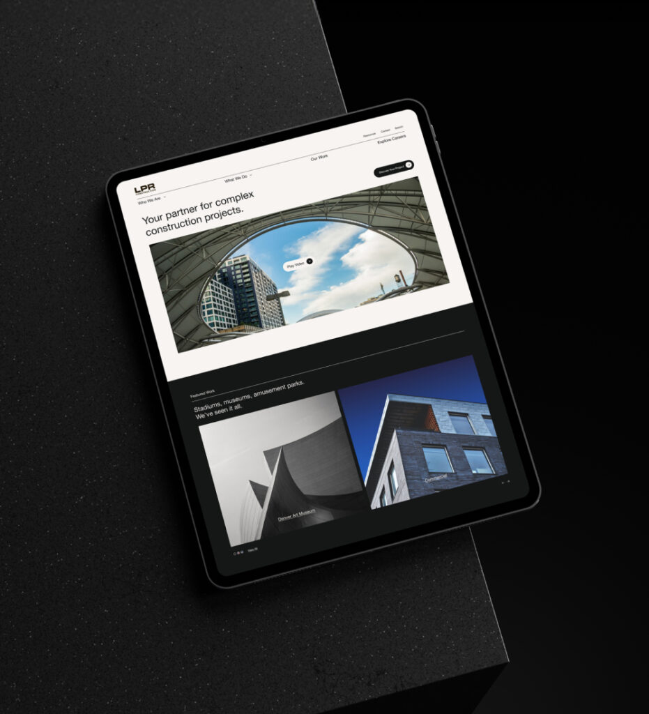 Tablet displaying website interface on dark background