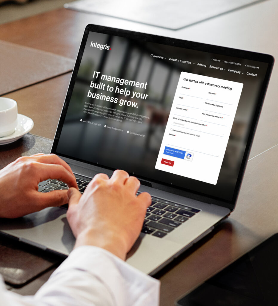 Person using laptop to interact with website interface