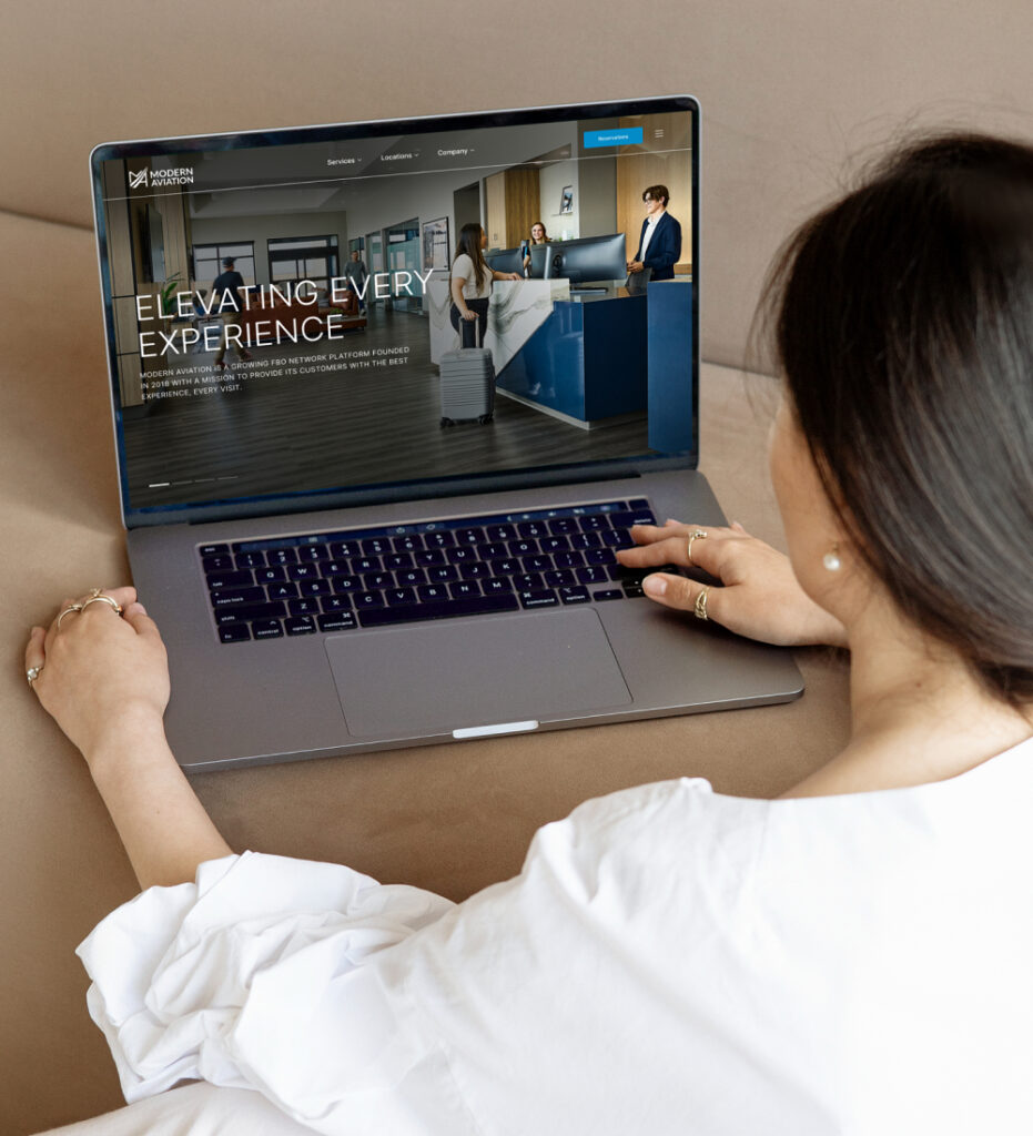 Person using laptop to browse website interface