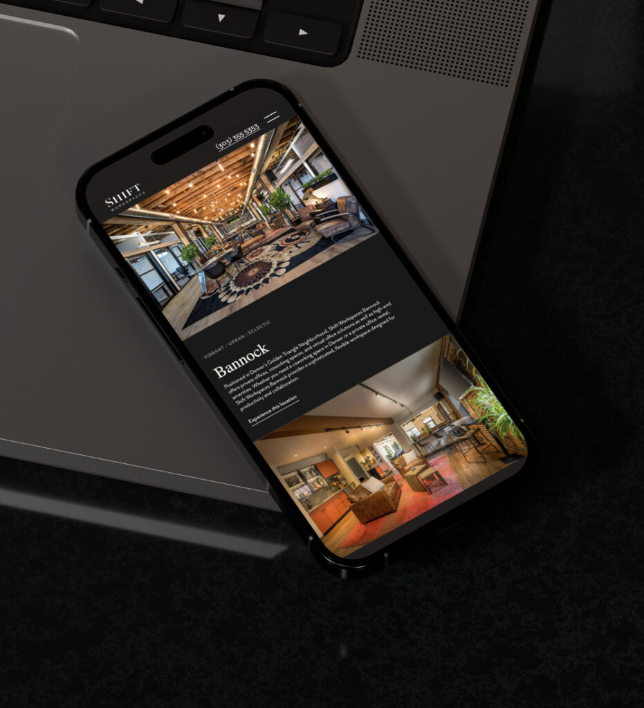 Smartphone displaying mobile website interface on dark surface
