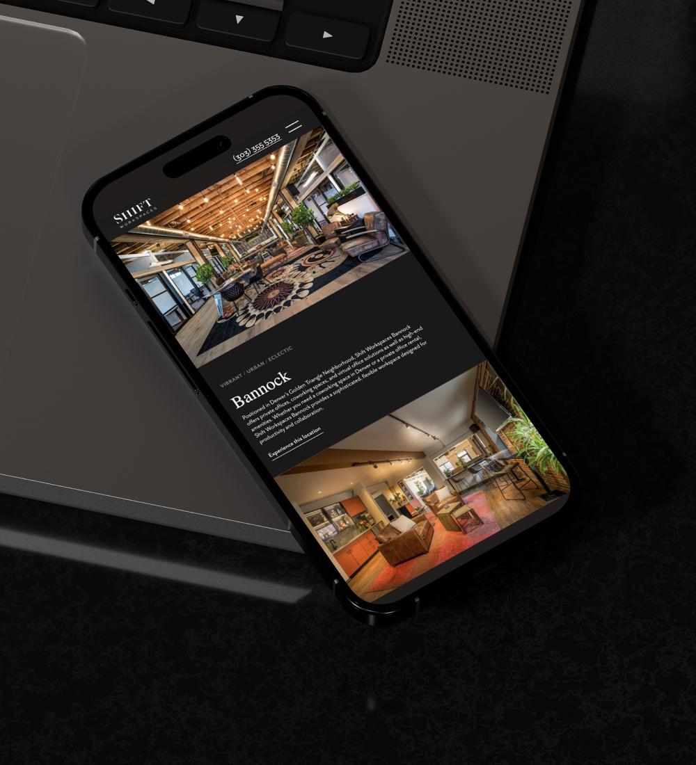 Smartphone displaying mobile website interface on dark surface