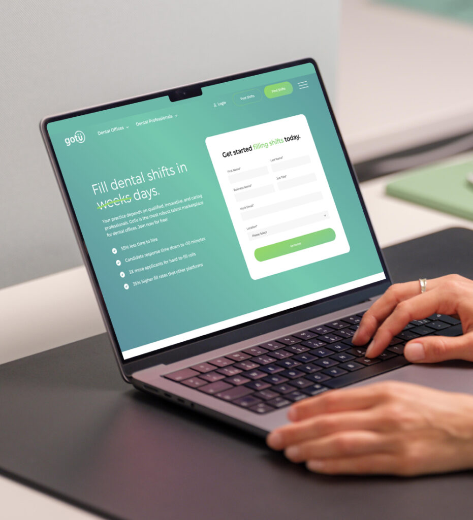 Laptop displaying website homepage with data visualization