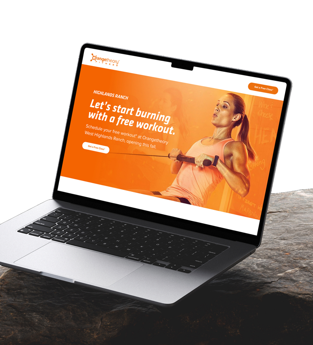 Laptop displaying fitness website homepage
