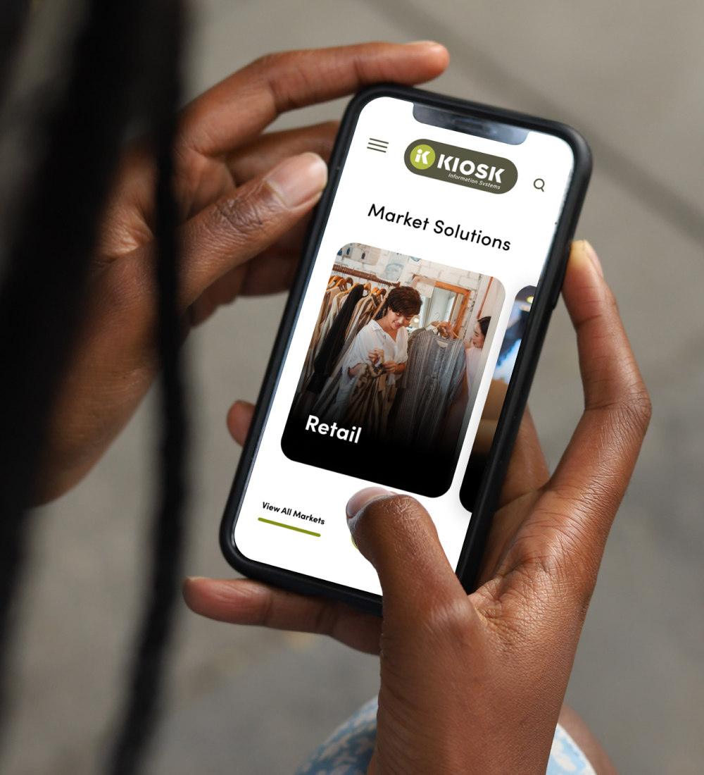Person using smartphone to browse website interface