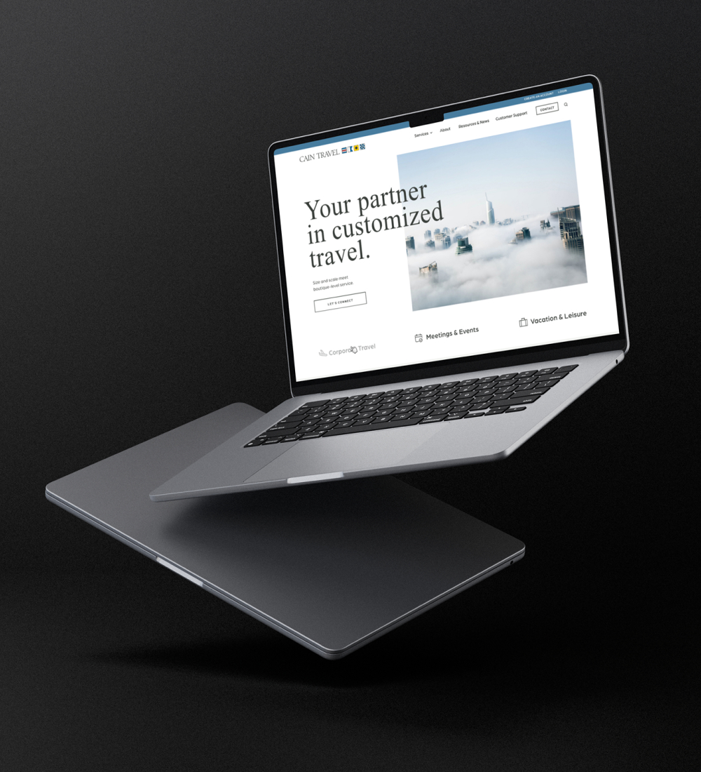 Laptop displaying website homepage with minimal design