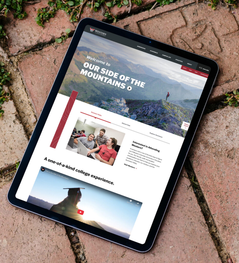 Tablet displaying website homepage outdoors