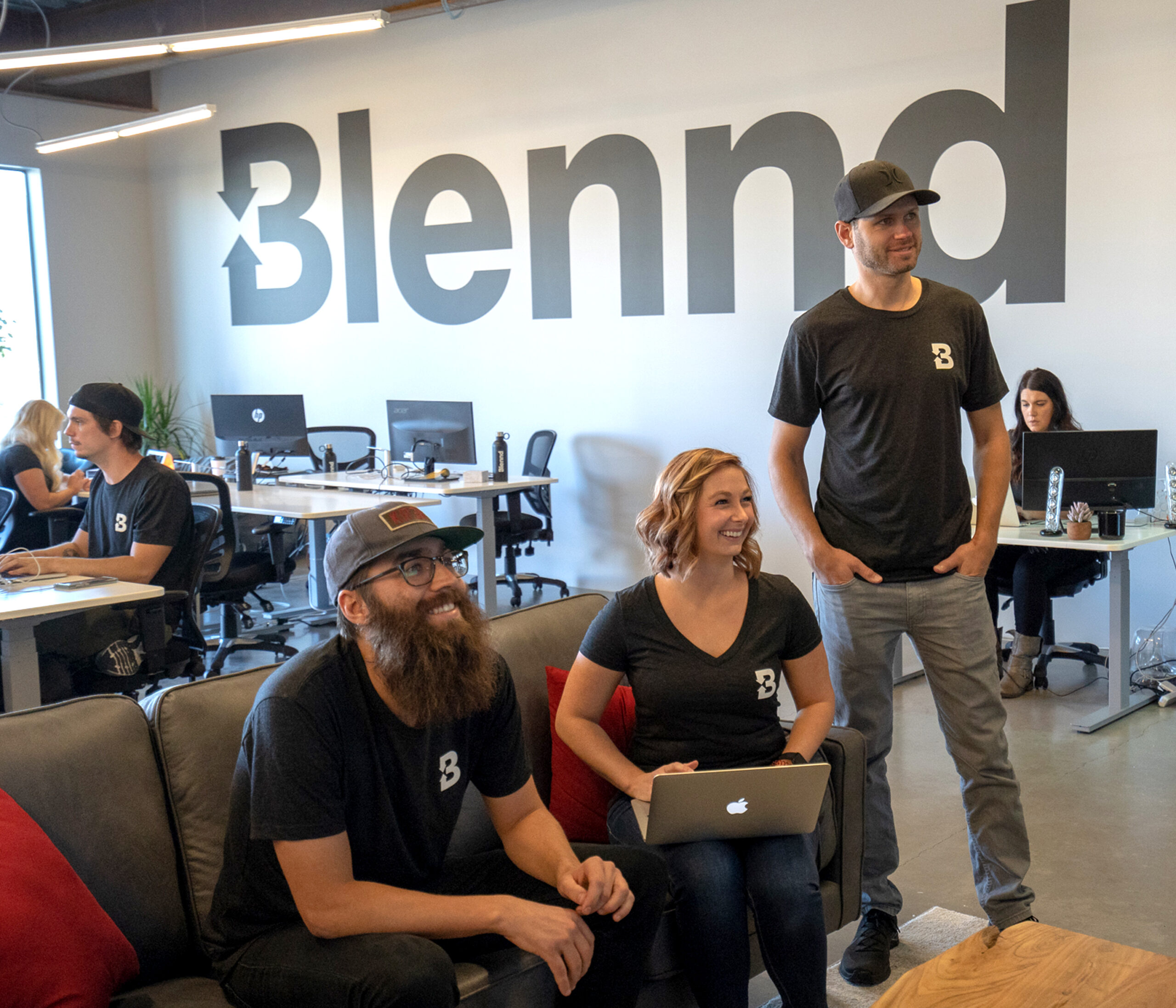 Blennd team collaborating in office workspace