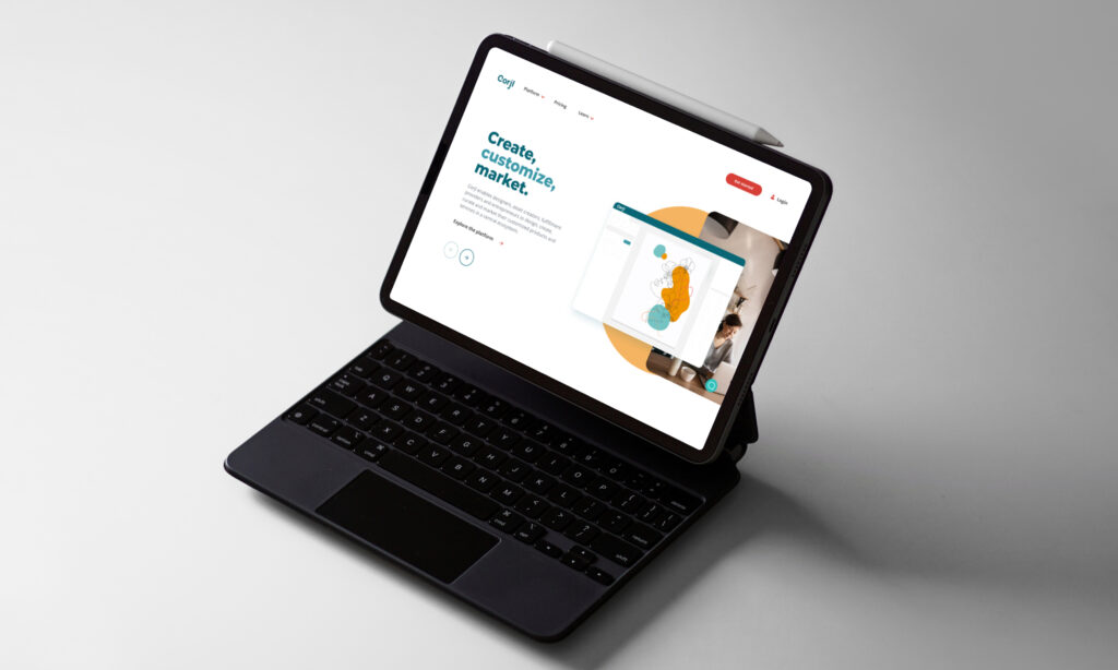 Laptop displaying website homepage design in workspace