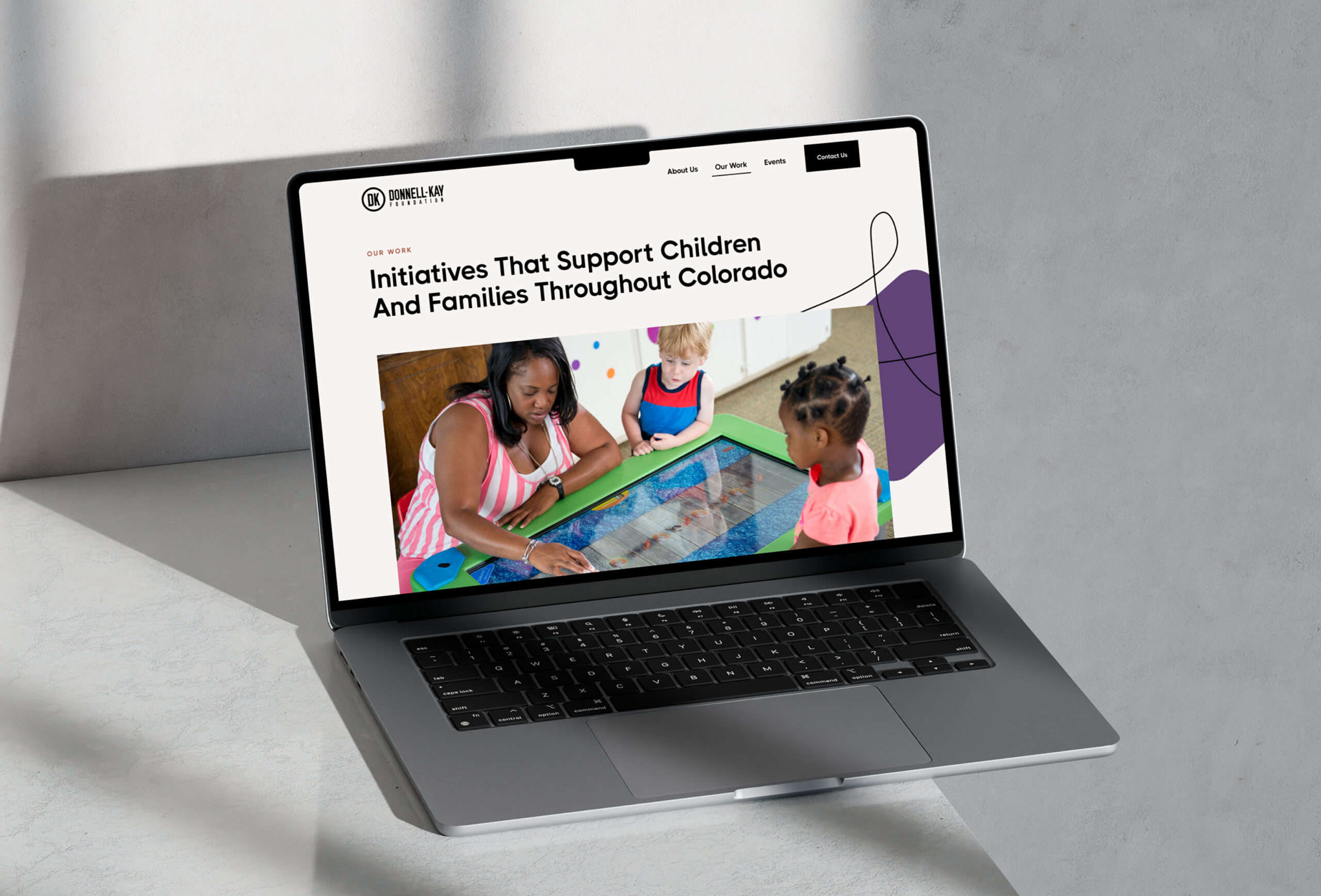 Laptop displaying website with service content sections