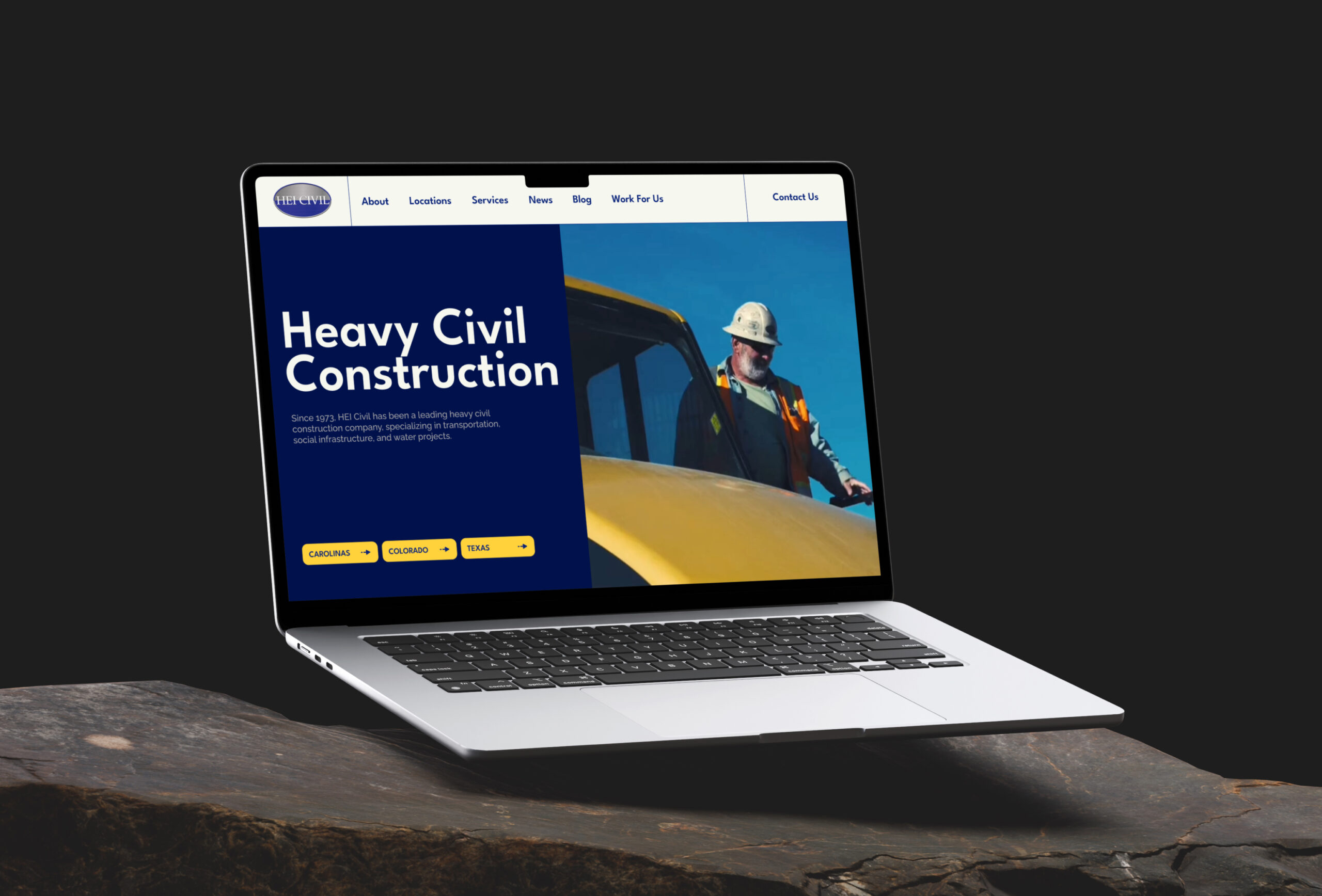 Laptop displaying website homepage with content sections