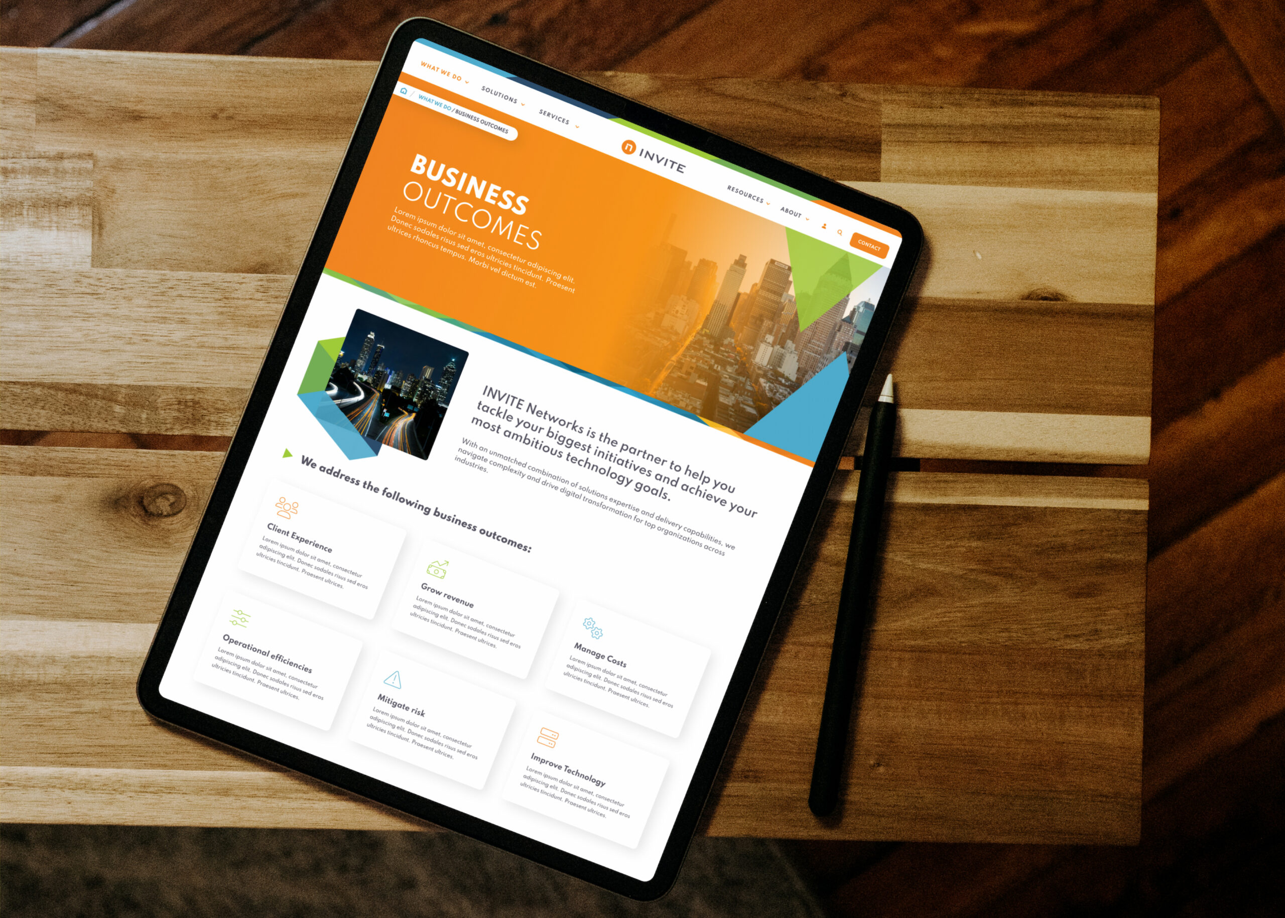 Tablet displaying website homepage on wooden surface