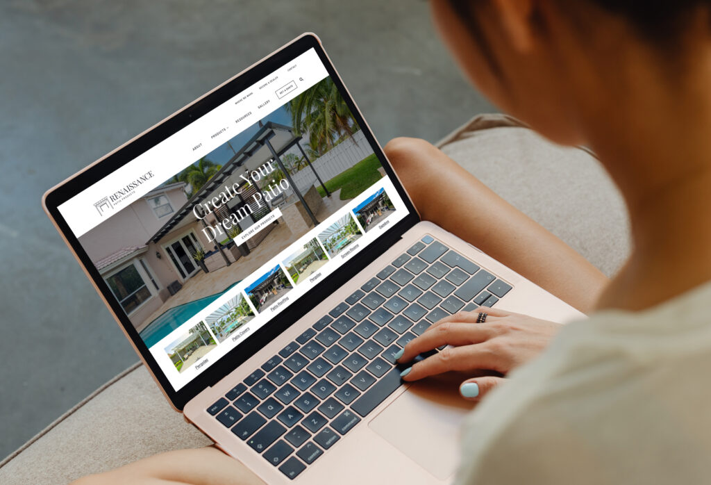 Person using laptop to browse website interface