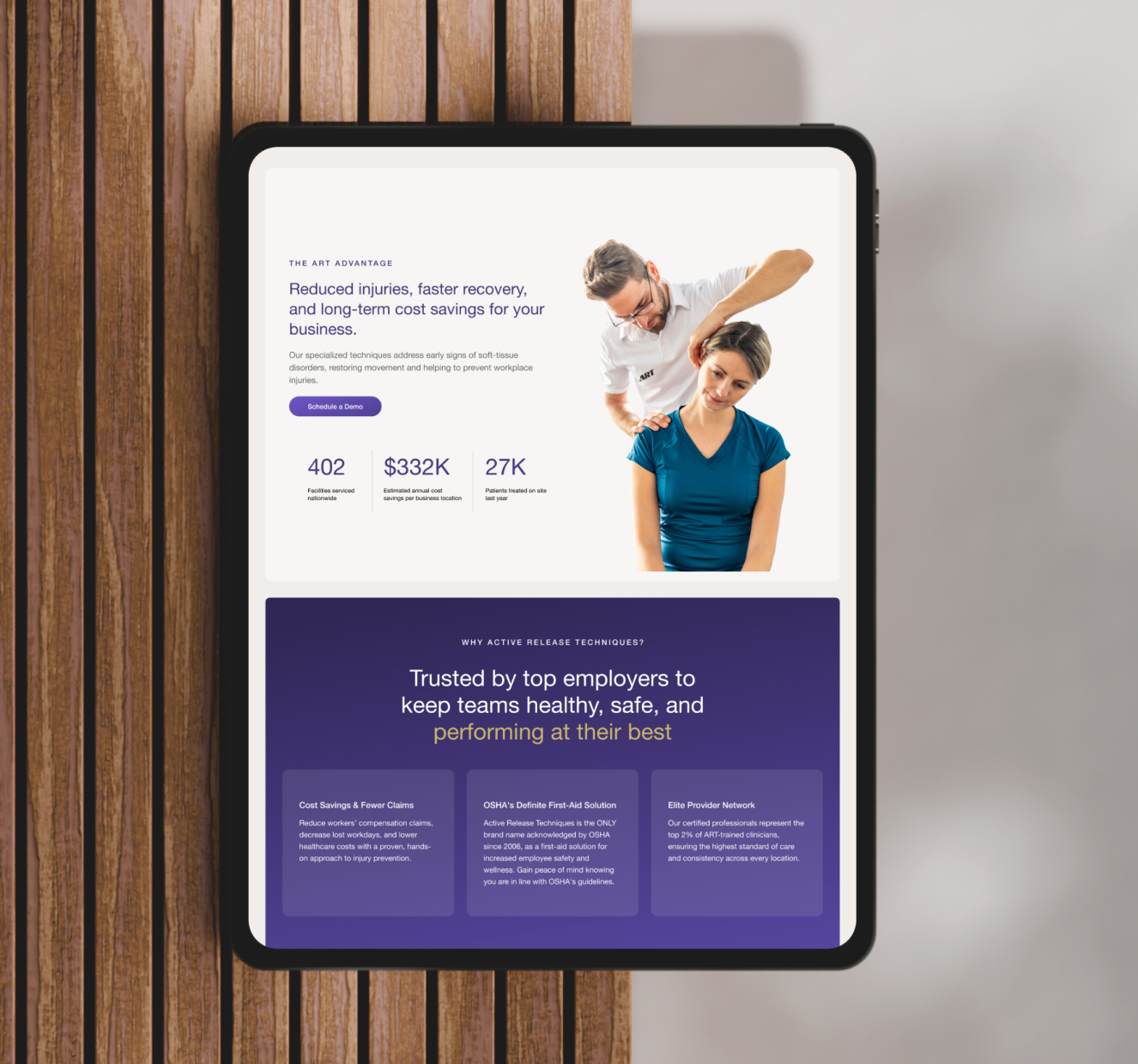 Tablet device showing app interface on wooden surface